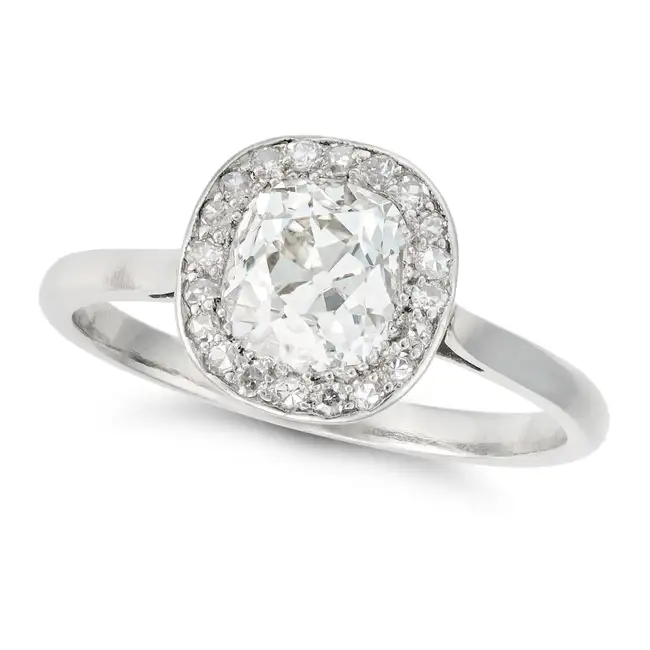 AN OLD CUT DIAMOND HALO RING in platinum, set with an old cut diamond of approximately 1.50