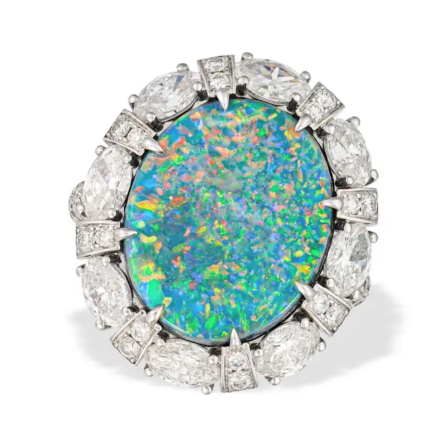 SALAVETTI, AN IMPORTANT UNTREATED 7.93 CARAT BLACK OPAL AND DIAMOND CLUSTER RING in 18ct white gold,
