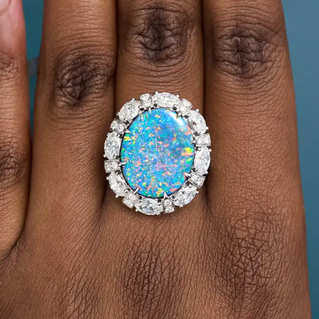 SALAVETTI, AN IMPORTANT UNTREATED 7.93 CARAT BLACK OPAL AND DIAMOND CLUSTER RING in 18ct white gold,
