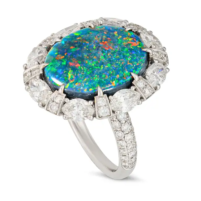SALAVETTI, AN IMPORTANT UNTREATED 7.93 CARAT BLACK OPAL AND DIAMOND CLUSTER RING in 18ct white gold,