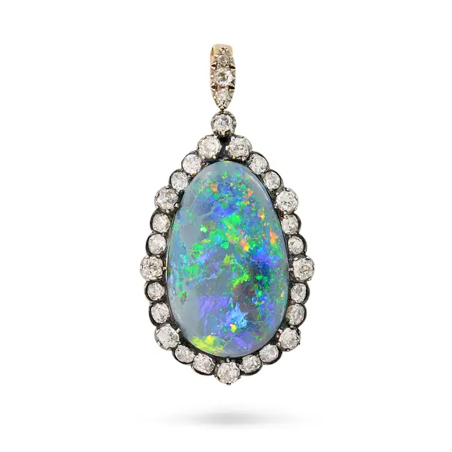 A FINE ANTIQUE BLACK OPAL AND DIAMOND PENDANT set with a cabochon black opal of approximately 16.