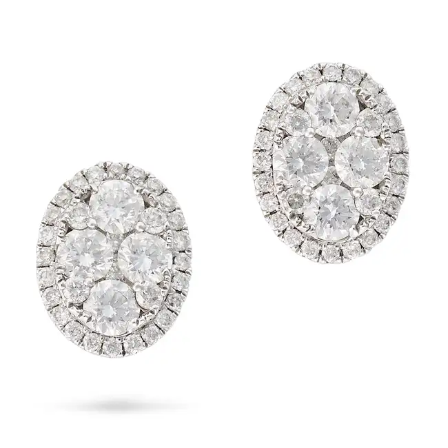A PAIR OF DIAMOND CLUSTER STUD EARRINGS in 18ct white gold, the oval earrings set with a cluster