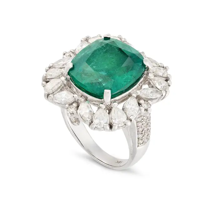 A FINE 10.27 CARAT ZAMBIAN MINOR EMERALD AND DIAMOND RING set with a cushion cut emerald of 10.27
