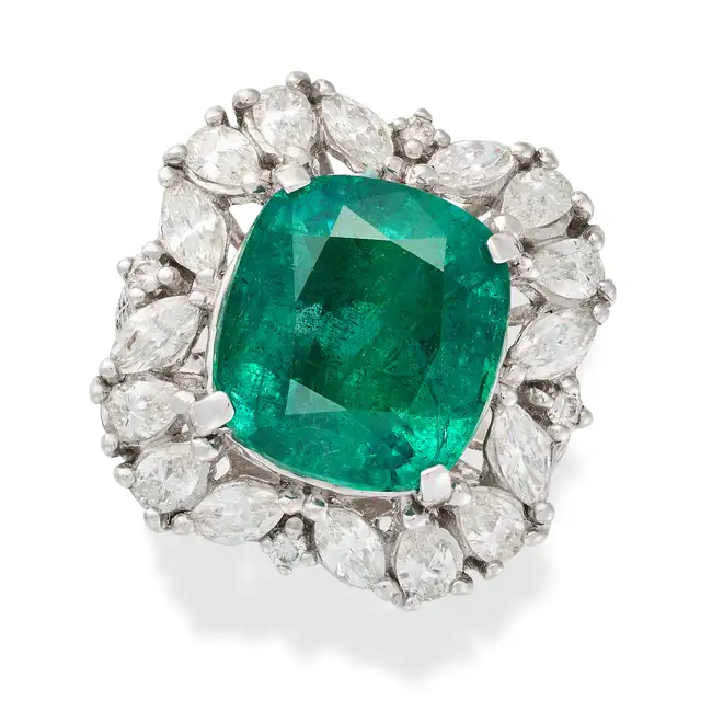 A FINE 10.27 CARAT ZAMBIAN MINOR EMERALD AND DIAMOND RING set with a cushion cut emerald of 10.27