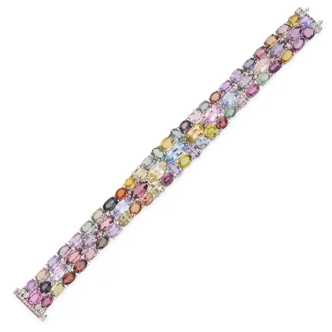 A MULTICOLOUR SAPPHIRE AND DIAMOND STRAP BRACELET set with variously cut blue, pink, yellow,