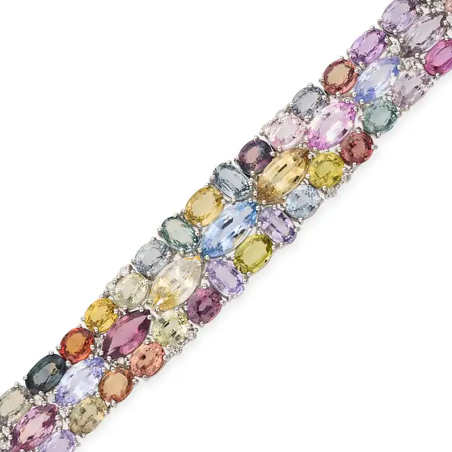 A MULTICOLOUR SAPPHIRE AND DIAMOND STRAP BRACELET set with variously cut blue, pink, yellow,