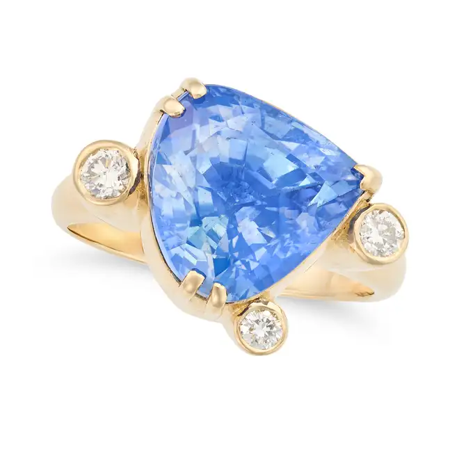AN IMPORTANT AND RARE 9.76 CARAT KASHMIR SAPPHIRE AND DIAMOND RING set with a pear shaped sapphire