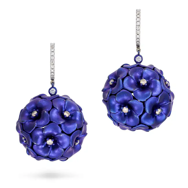 ALEXIS NY, A PAIR OF TITANIUM AND DIAMOND FLOWER DROP EARRINGS each comprising a hoop set with a row