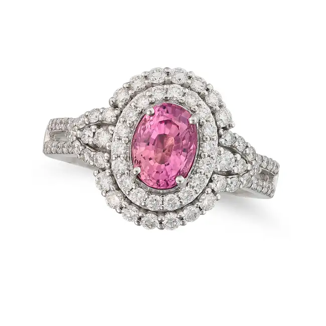 OSCAR FRIEDMAN, A PINK SAPPHIRE AND DIAMOND RING set with an oval cut pink sapphire of 1.49 carats