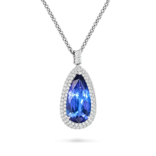 NO RESERVE - A FINE 8.39 CARAT TANZANITE AND DIAMOND PENDANT NECKLACE the pendant set with a pear