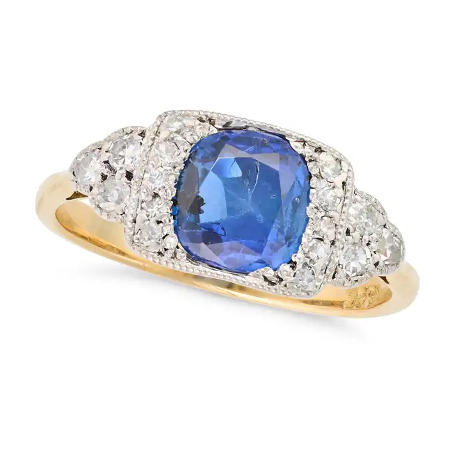 A FINE ANTIQUE SAPPHIRE AND DIAMOND DRESS RING, EARLY 20TH CENTURY set with a cushion cut sapphire