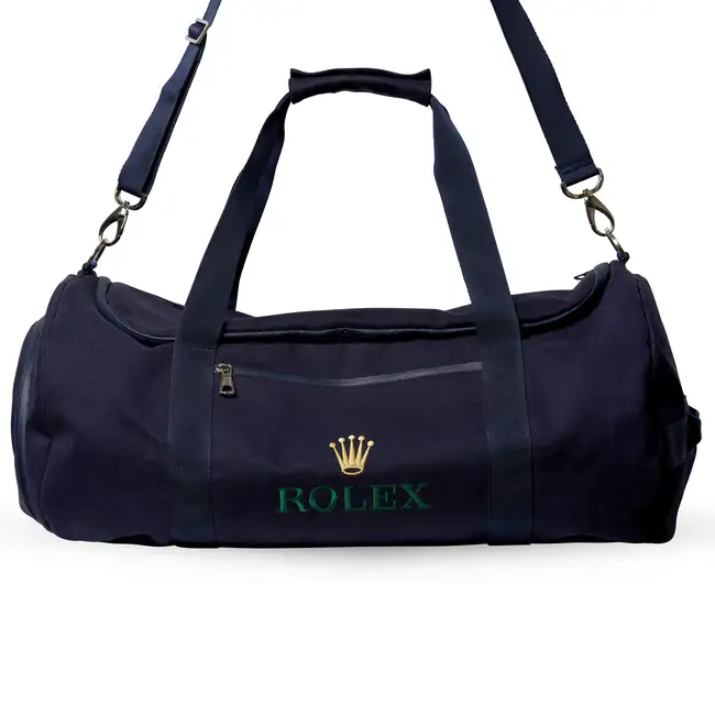 NO RESERVE - ROLEX, A BLUE CANVAS DUFFLE BAG Dark blue canvas exterior with canvas handles, a