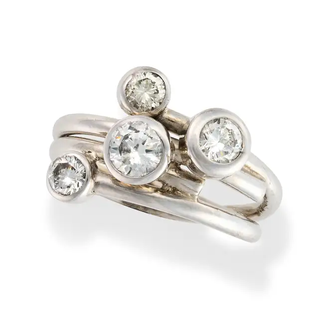 A DIAMOND BUBBLE DRESS RING set with four round brilliant cut diamonds, the diamonds totalling 1.1-