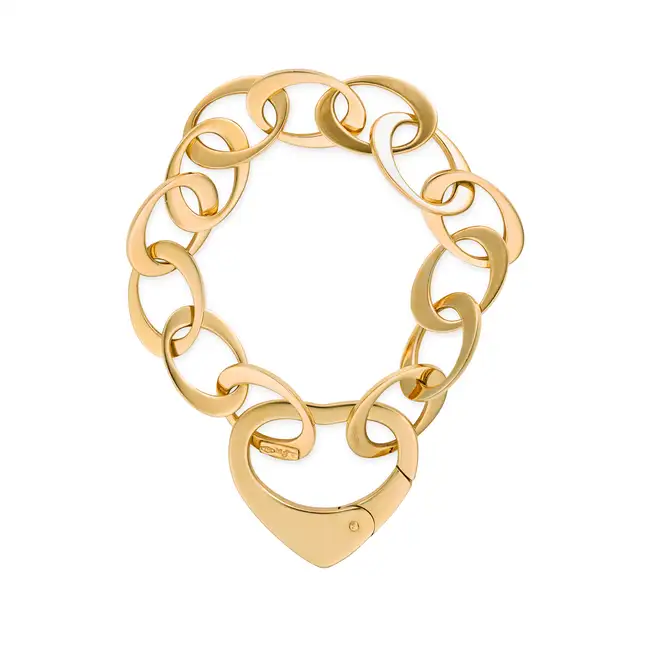 MAPPIN & WEBB, A GOLD HEART BRACELET in 18ct yellow gold, comprising a row of oval links, the