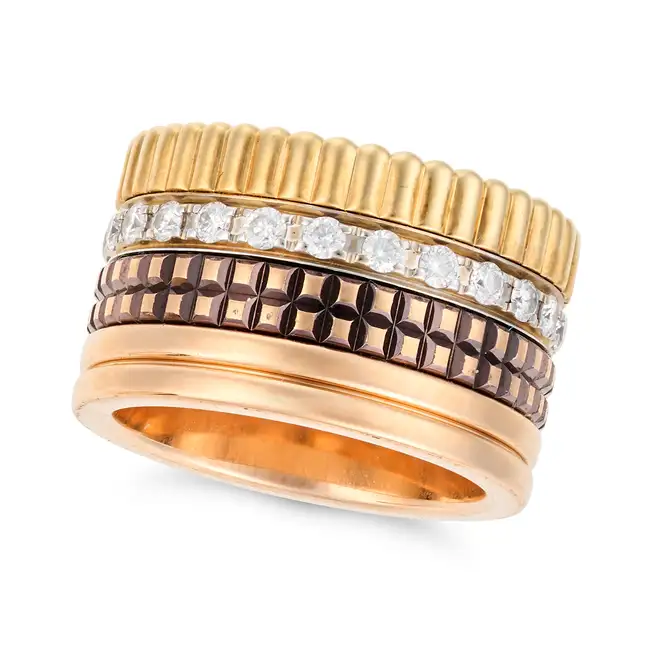 BOUCHERON, A DIAMOND QUATRE CLASSIQUE RING comprising four bands, one a fluted gold band, one a