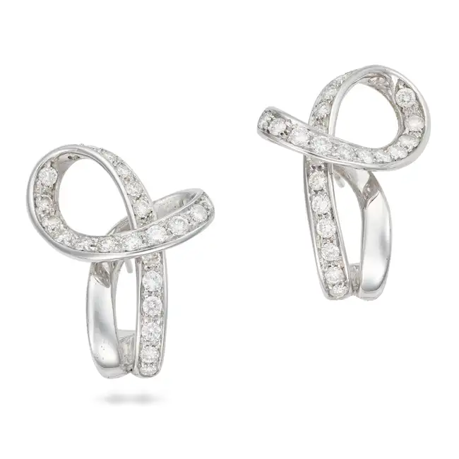 SCAVIA, A PAIR OF DIAMOND EARRINGS each in a scrolling design, set with round brilliant cut