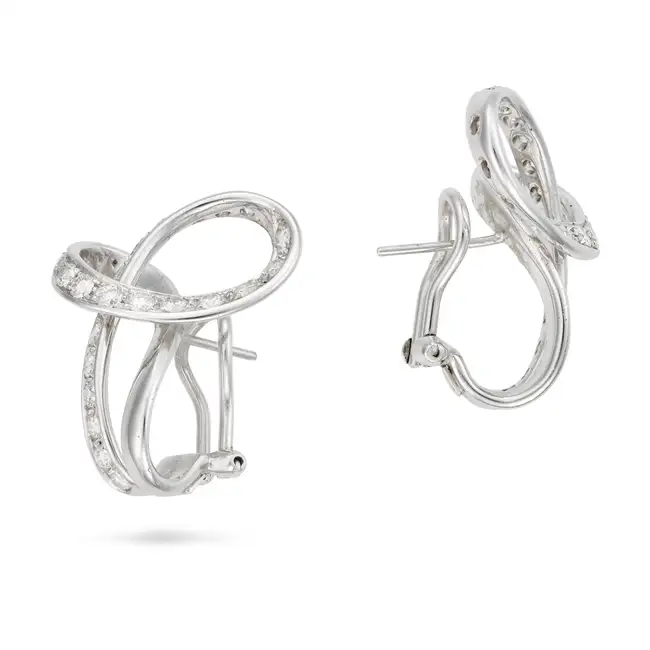 SCAVIA, A PAIR OF DIAMOND EARRINGS each in a scrolling design, set with round brilliant cut
