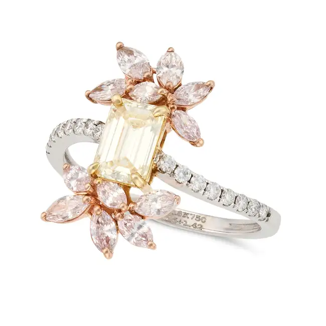 A YELLOW AND PINK DIAMOND RING set with an emerald cut yellow diamond, accented by sprays of