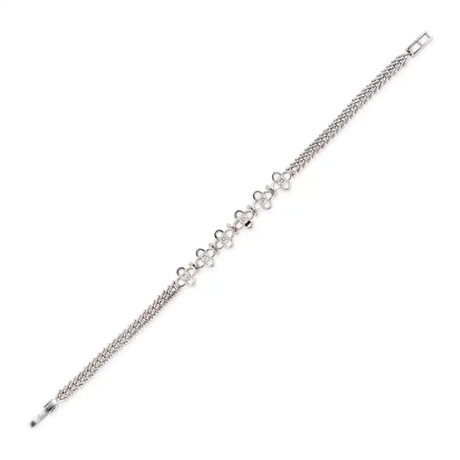 A DIAMOND BRACELET designed as a row of flowers set with round brilliant cut diamonds totalling 0.42