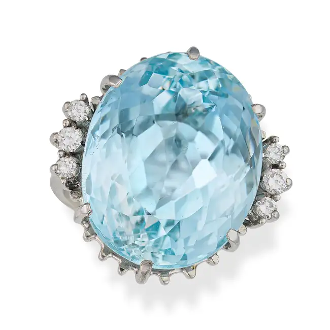 A FINE AQUAMARINE AND DIAMOND DRESS RING set with an oval cut aquamarine of approximately 28.28