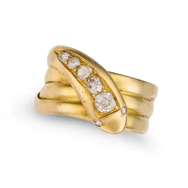 AN ANTIQUE VICTORIAN DIAMOND SNAKE RING,1884 in 18ct yellow gold, designed as a coiled snake, the