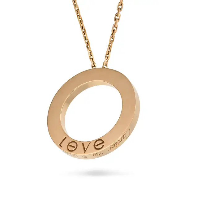 CARTIER, A GOLD LOVE PENDANT NECKLACE in 18ct rose gold, the circular pendant punctuated by six