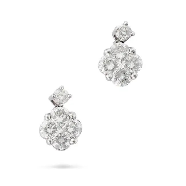A PAIR OF DIAMOND DROP EARRINGS in 18ct white gold, each suspending a cluster of round brilliant cut