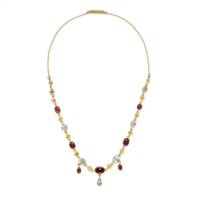 AN ANTIQUE GARNET AND AQUAMARINE NECKLACE comprising a trace chain set with oval cabochon garnets