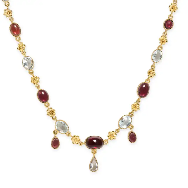 AN ANTIQUE GARNET AND AQUAMARINE NECKLACE comprising a trace chain set with oval cabochon garnets
