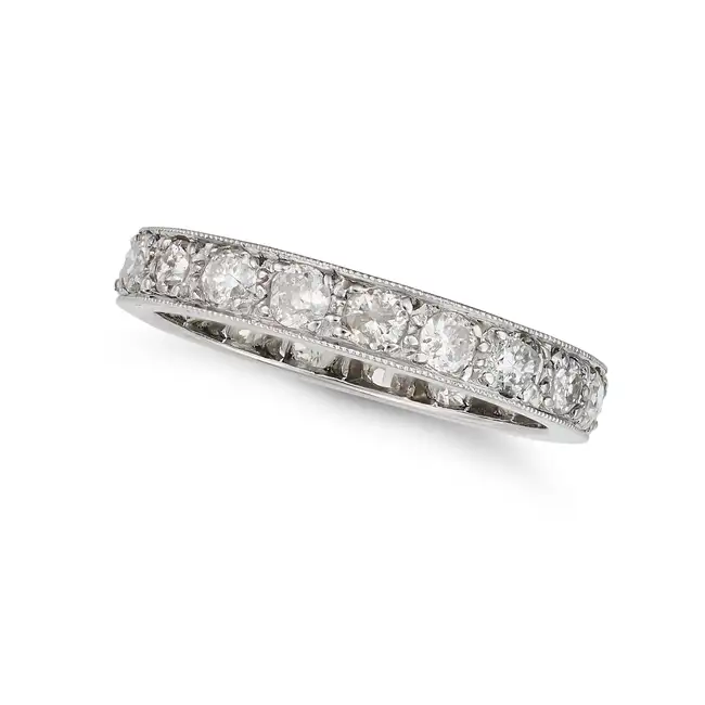 A DIAMOND FULL ETERNITY RING set all around with a row of old cut diamonds, the diamonds all