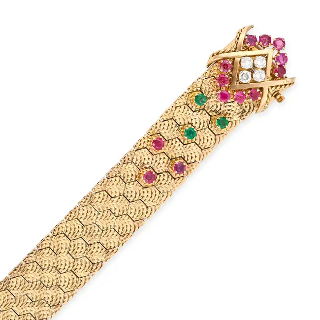 MAUBOUSSIN, A FINE VINTAGE RUBY, EMERALD AND DIAMOND BRACELET in 18ct yellow gold, comprising a