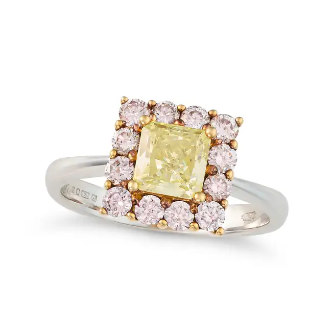 A YELLOW AND PINK DIAMOND DRESS RING in 18ct white and rose gold, set with a princess cut yellow