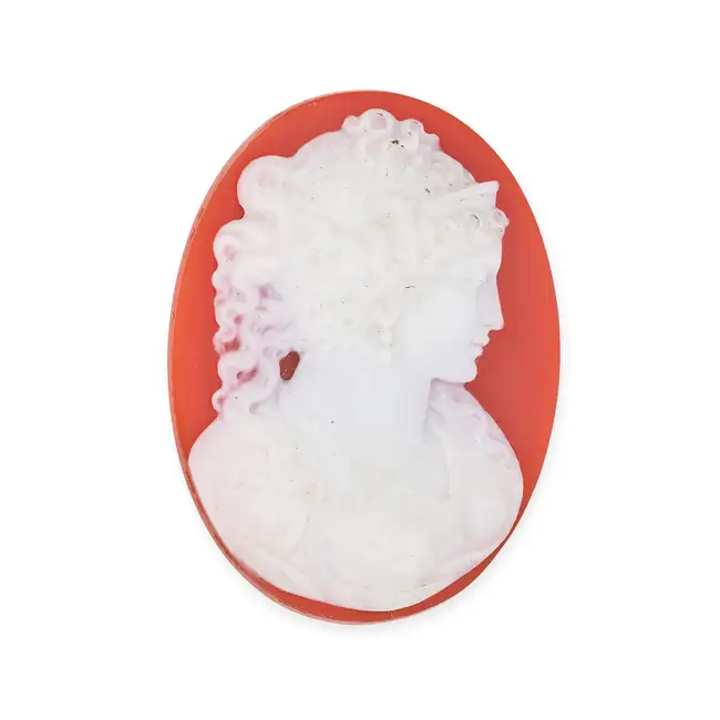 AN UNMOUNTED SARDONYX CAMEO the oval cameo carved in to depict the bust of a Napoleonic woman