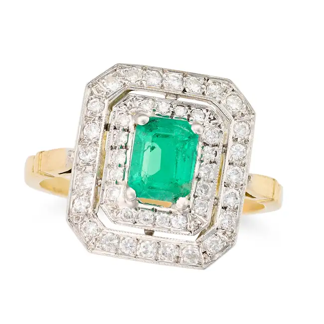 AN EMERALD AND DIAMOND DRESS RING set with an octagonal step cut emerald of approximately 0.93