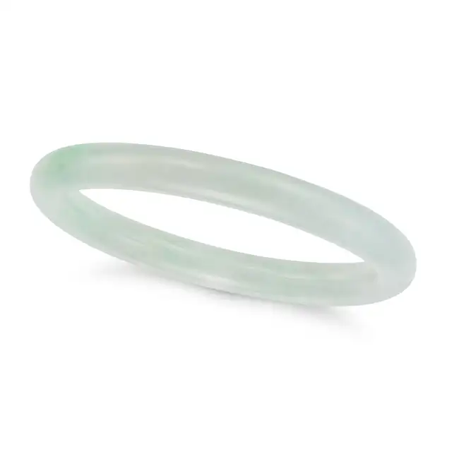 A JADEITE JADE BANGLE comprising a single hoop of polished jadeite jade, inner circumference 18.5cm,