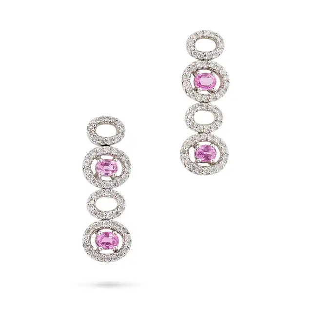 A PAIR OF PINK SAPPHIRE AND DIAMOND DROP EARRINGS in 18ct white gold, each comprising a row of