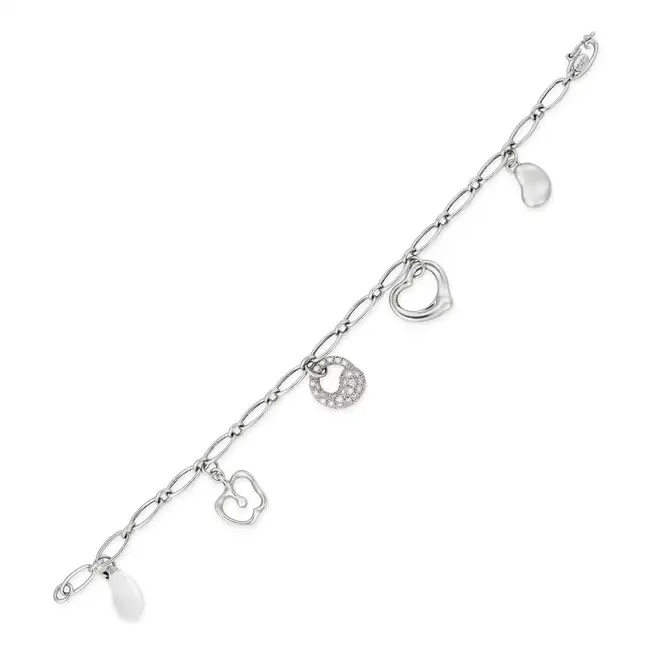 ELSA PERETTI FOR TIFFANY & CO., A DIAMOND AND ROCK CRYSTAL CHARM BRACELET the oval link bracelet