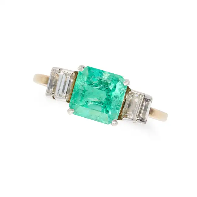 AN EMERALD AND DIAMOND DRESS RING set with an octagonal step cut emerald of approximately 1.66
