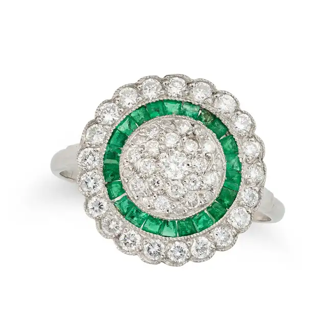 A DIAMOND AND EMERALD TARGET RING pave set with round brilliant cut diamonds, within concentric