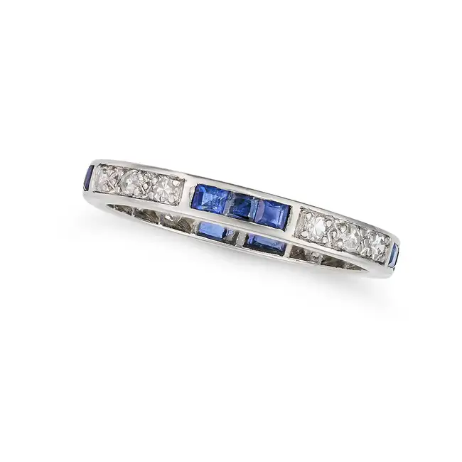 A SAPPHIRE AND DIAMOND FULL ETERNITY RING set all around with trios of step cut sapphires and single