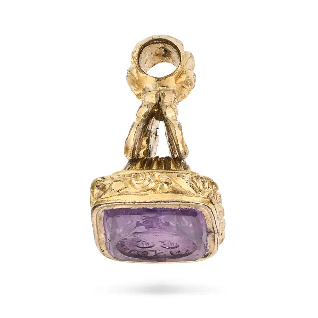 AN ANTIQUE AMETHYST FOB SEAL / PENDANT the scrolling foliate style pendant set with an amethyst