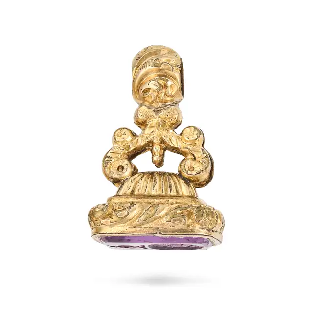 AN ANTIQUE AMETHYST FOB SEAL / PENDANT the scrolling foliate style pendant set with an amethyst