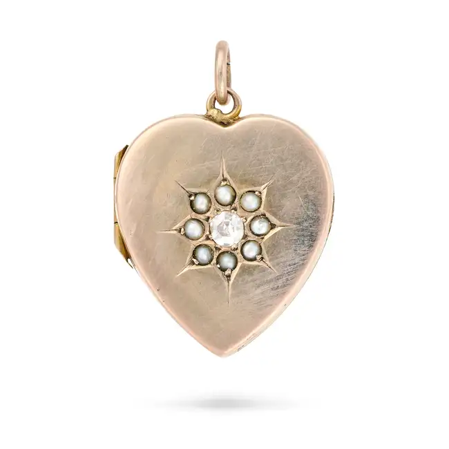 AN ANTIQUE DIAMOND AND PEARL HEART LOCKET PENDANT the heart shaped locket set with an old cut
