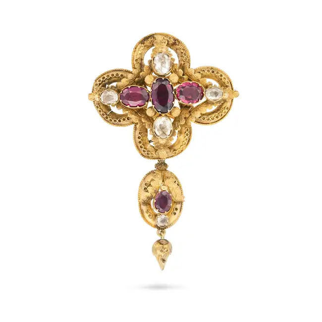 AN ANTIQUE VICTORIAN GARNET AND ROCK CRYSTAL BROOCH the foliate style brooch set with oval cut