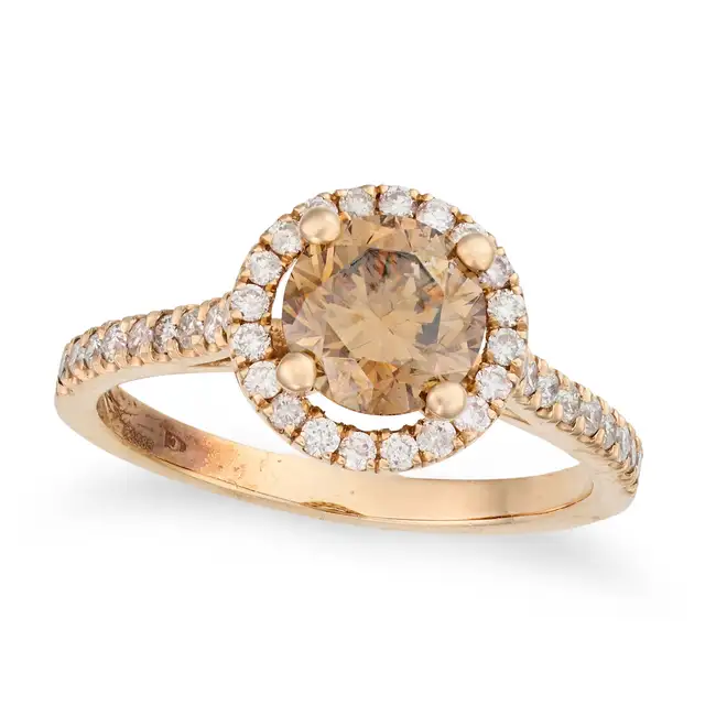A COGNAC DIAMOND RING set with a round brilliant cut cognac diamond of approximately 1.25 carats