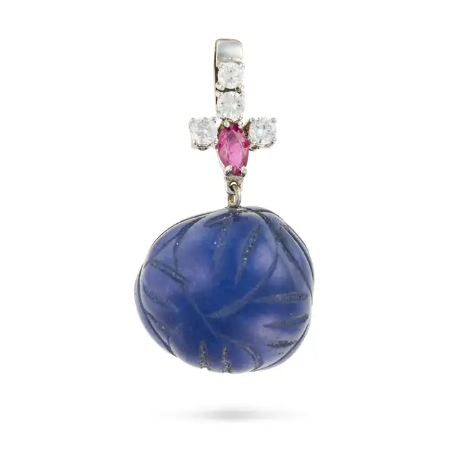 A CARVED SAPPHIRE BEAD, DIAMOND AND RUBY PENDANT comprising a carved sapphire bead, suspended from a