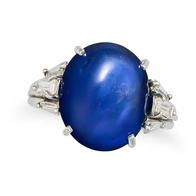AN IMPORTANT 16.34 CARAT BURMA NO HEAT SAPPHIRE AND DIAMOND DRESS RING in platinum, set with an oval
