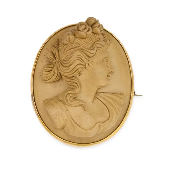NO RESERVE - AN ANTIQUE LAVA CAMEO BROOCH, CIRCA 1870 set with a lava cameo carved in high relief,