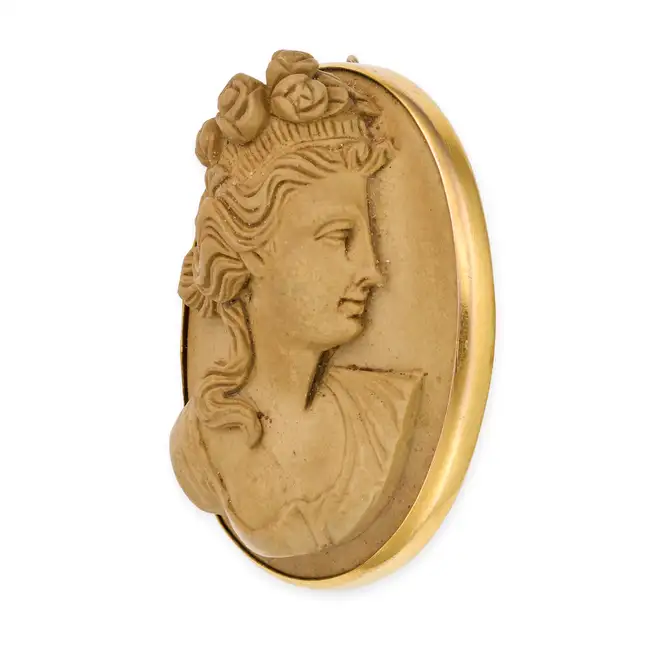NO RESERVE - AN ANTIQUE LAVA CAMEO BROOCH, CIRCA 1870 set with a lava cameo carved in high relief,