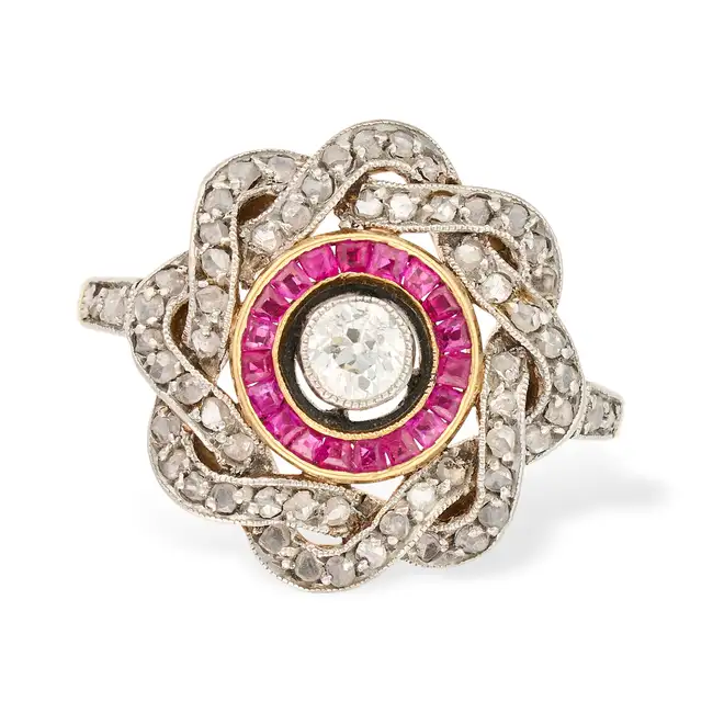 AN ANTIQUE DIAMOND AND RUBY DRESS RING, EARLY 20TH CENTURY in yellow gold and silver, set with an